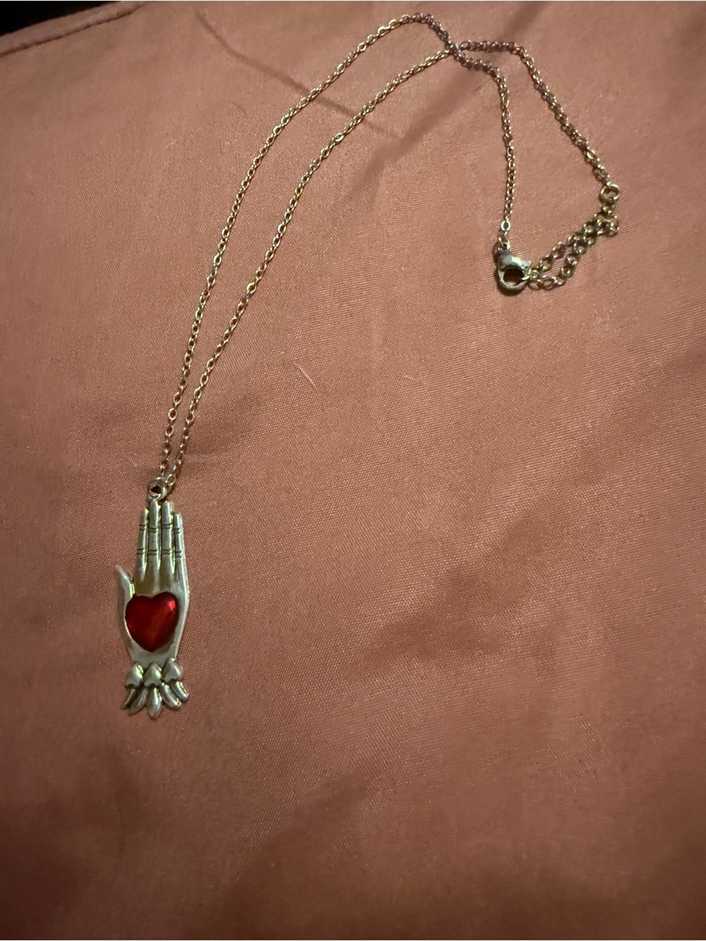 Silver-Tone Hand Pendant Necklace with Red Heart
